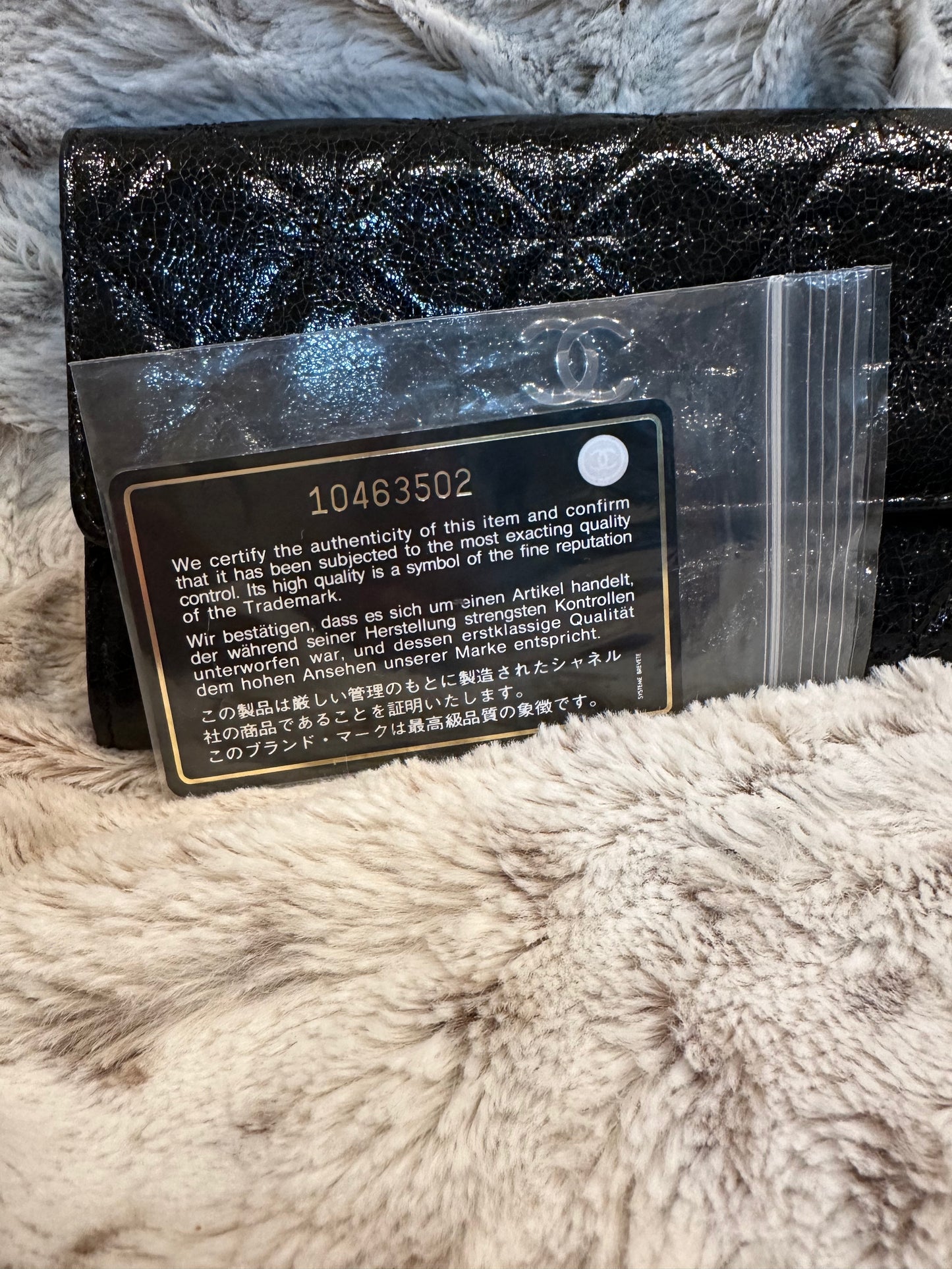 Pre-owned AUTHENTIC Chanel Classic Flap Wallet in black crackled (distressed) leather with silver-tone CC. #18